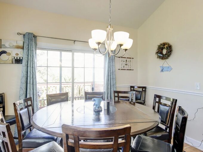 A dining room table with chairs around it