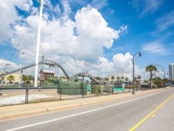 A view of a roller coaster from the side.