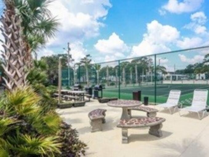 A view of a tennis court from the patio.